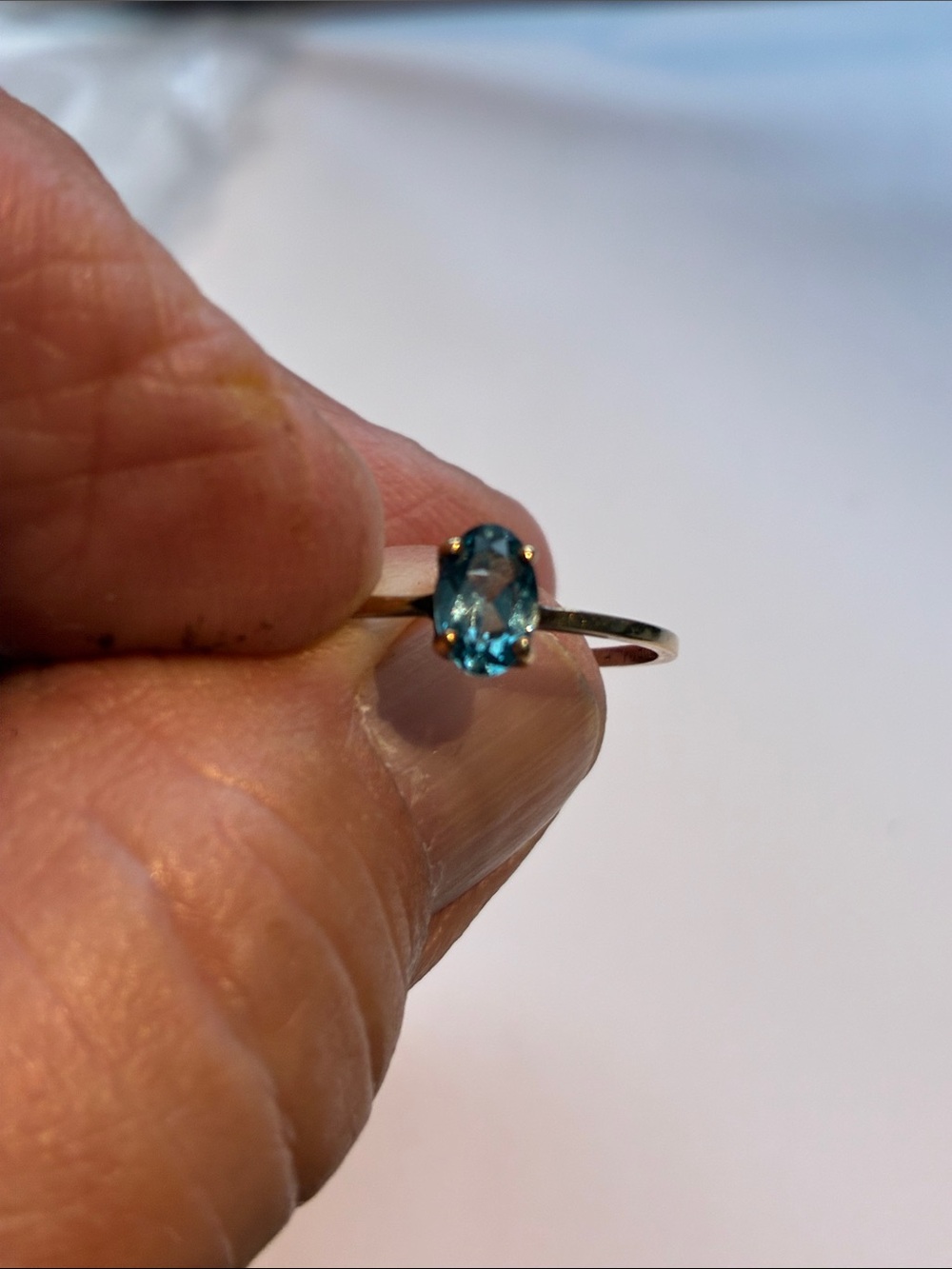 Delicate 10k Gold Ring with Oval Blue Topaz Stone.  Size 6